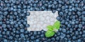 Pile of fresh blueberries with mint leaves on table Royalty Free Stock Photo