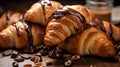 Pile of fresh chocolate croissants with chocolate cream, breakfast food concept. Freshly baked crusty chocolate croissants on