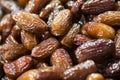 Pile of fresh dried date fruits on a traditional craftsman market. Fruit background. selective focus Royalty Free Stock Photo