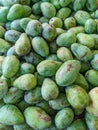 Pile of fresh green mangos for sale at the fruit market Royalty Free Stock Photo