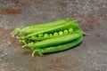 A pile of fresh green peas on a kitchen worktop tile Royalty Free Stock Photo