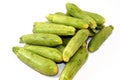 Pile of fresh green zucchini or courgette vegetables isolated on white background, selective focus of fresh raw organic squash Royalty Free Stock Photo