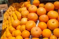 Pile of fresh natural organic orange fruit background in orange color and marked skin texture selling in fruit juice shop Royalty Free Stock Photo