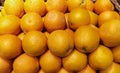 Pile of fresh oranges in a basket close-up shot. Royalty Free Stock Photo