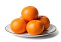 Pile of fresh oranges on a plate isolated on white background Royalty Free Stock Photo