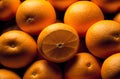 A pile of fresh oranges with a sliced one on top. Created with Generative AI Royalty Free Stock Photo