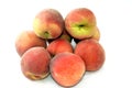 pile of fresh peach fruit isolated on white background, selective focus of a stack of ripe bright peaches, healthy fresh food