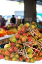 Pile of fresh Rambutan on sale in a fruit market