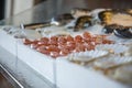 Pile of fresh red shrimps for sale on the seafood market, seafood on ice in Greece. Royalty Free Stock Photo