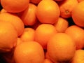 Pile of fresh ripe oranges with leaves as background.Oranges background Royalty Free Stock Photo