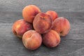 Pile of fresh, ripe peaches on wooden table Royalty Free Stock Photo