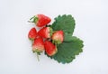 Pile of fresh strawberries with green leaves on white background Royalty Free Stock Photo