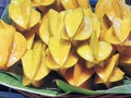 Pile of Fresh Yellow Star Fruits on Banana Leaf Royalty Free Stock Photo