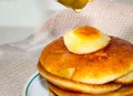 A pile of fried pancakes on which fruit jam is poured on top Royalty Free Stock Photo