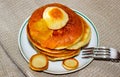 A pile of fried pancakes on which fruit jam is poured on top Royalty Free Stock Photo