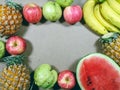 Pile of fruits, Assortment of exotic fruits isolated on grey background. Creative layout made of fresh fruits. Royalty Free Stock Photo