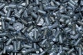 Pile of galvanized metal steel countersunk head screws