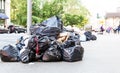 Pile of garbage bags on city street. Royalty Free Stock Photo