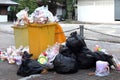 Pile of Garbage plastic black and trash bag waste many on the footpath, pollution trash, Plastic Waste and bag foam tray garbage Royalty Free Stock Photo