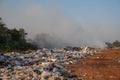 Pile of garbage with smoke to burn Royalty Free Stock Photo