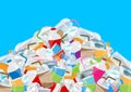 Pile garbage waste plastic and paper in mountain shape isolated on blue background, bottles plastic garbage waste many stack