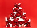 Pile of gift boxes and tiny Christmas trees. Royalty Free Stock Photo