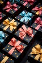 Pile of gifts in black boxes with bow