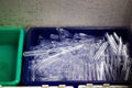 Pile of glass test tubes on a blue plastic tray