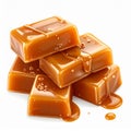 Pile of Glossy Caramel Squares with Dripping Sauce on White Background Royalty Free Stock Photo