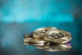 Pile of gold bitcoin cryptocurrency coins with purple digital ha