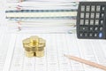 Pile of gold coins and brown pencil on finance account Royalty Free Stock Photo