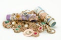 Pile of gold jewelry on white background