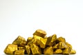 A pile of gold nuggets or gold ore on white background, precious Royalty Free Stock Photo