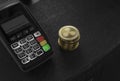 A pile of gold Ripple Crypto currency coins and POS terminal. Ripples Cryptocurrency. E-commerce, business, finance Royalty Free Stock Photo