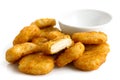 Pile of golden deep-fried battered chicken nuggets with empty bo Royalty Free Stock Photo