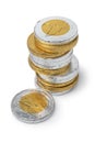 Pile of golden and silver chocolate coins close up on white background Royalty Free Stock Photo