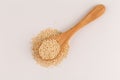 Pile of grain quinoa seeds in spoon