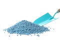 Pile of granular mineral fertilizer with shovel on white background Royalty Free Stock Photo