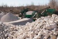 Pile of gravel-rock.Blurred on background machinery of quarry. Royalty Free Stock Photo