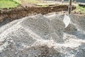 Pile of gravel sand with a shovel