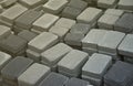 Pile of gray and dark grey walkway slab lying down outdoor. Material for Paving Slabs by mosaic close-up. Cobblestone Royalty Free Stock Photo