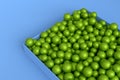 Pile of green fitness ball or fitball falling on blue background