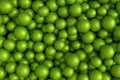 Pile of green fitness ball or fitball falling on white background