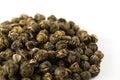 A pile of green jasmine pearl dried tea. Chinese traditional fragrant tea, rolled into small balls Royalty Free Stock Photo