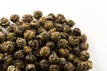 A pile of green jasmine pearl dried tea on a white background. Chinese traditional tea Royalty Free Stock Photo