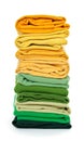 Pile of green and yellow folded clothes