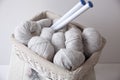 Pile of grey yarns