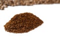 Pile of the ground coffee flakes isolated over the white background. pile of melted coffee Royalty Free Stock Photo