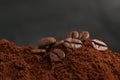 Pile of ground coffee with roasted beans, closeup Royalty Free Stock Photo