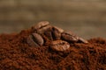 Pile of ground coffee with roasted beans, closeup Royalty Free Stock Photo